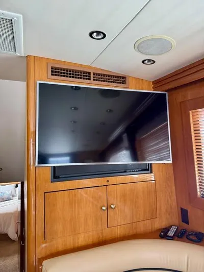  Yacht Photos Pics Interior of 2002 Hatteras 55 Convertible yacht with mounted flat-screen TV.