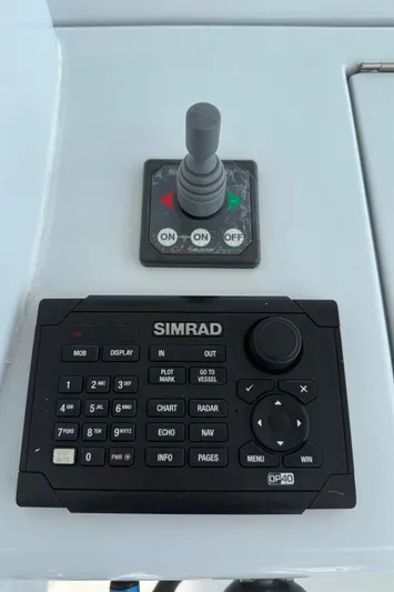  Yacht Photos Pics Control panel of a 2002 Hatteras 55 Convertible with Simrad navigation system.