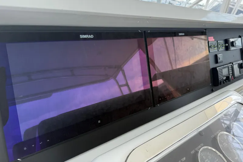  Yacht Photos Pics Control panel of a 2002 Hatteras 55 Convertible yacht with Simrad displays.