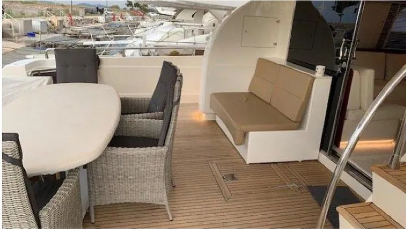  Yacht Photos Pics Luxury Posillipo 65 yacht deck with seating and table, 2005 model.