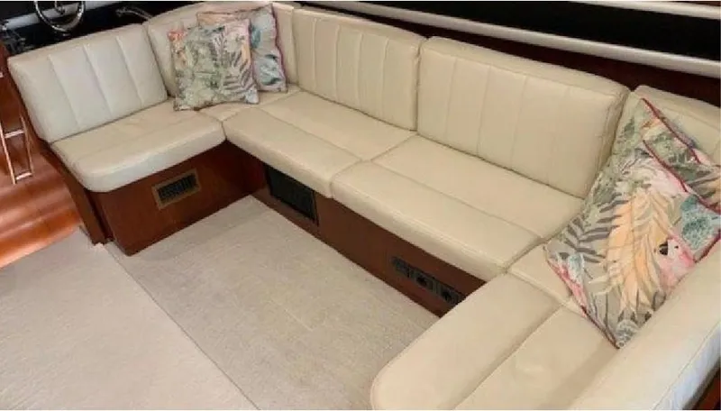  Yacht Photos Pics Luxurious beige leather seating on 2005 Posillipo 65 yacht with decorative pillows.