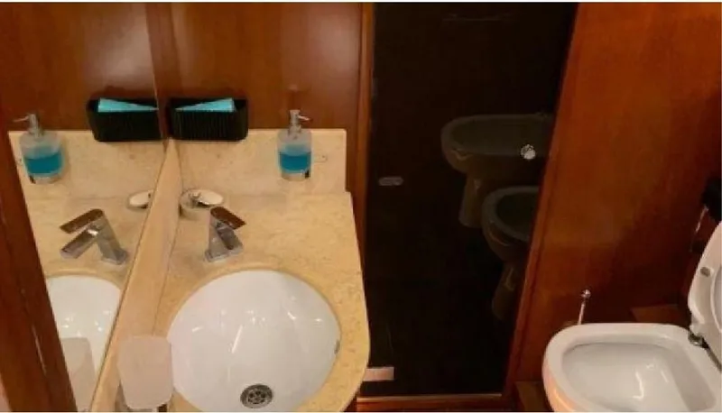  Yacht Photos Pics Luxurious bathroom interior of 2005 Posillipo 65 yacht with sink and toilet.