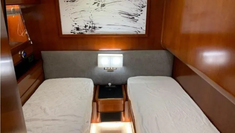  Yacht Photos Pics Twin cabin interior of 2005 Posillipo 65 yacht with modern decor and artwork.