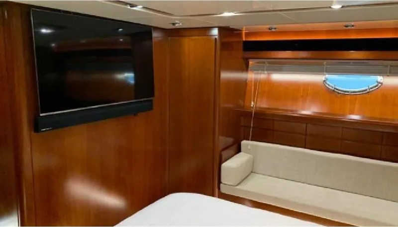  Yacht Photos Pics Luxurious interior of 2005 Posillipo 65 yacht with wood paneling and modern amenities.