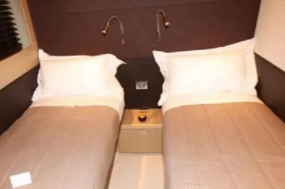  Yacht Photos Pics Twin beds in a 2005 Posillipo 65 yacht cabin with modern decor.