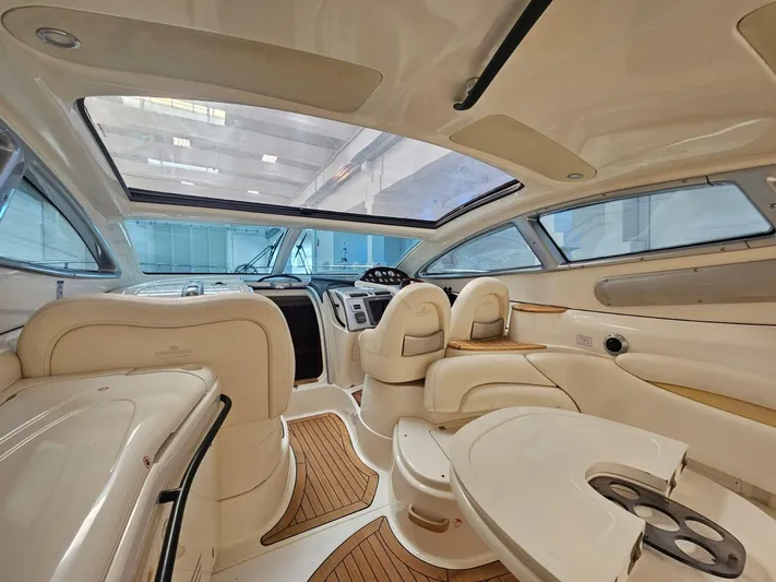 Bruno Dessi Yacht Photos Pics Luxurious interior of 2006 Cranchi Mediterranee 50 HT yacht with elegant seating and modern dashboard.