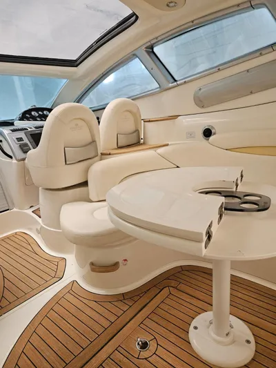 Bruno Dessi Yacht Photos Pics Luxurious interior of 2006 Cranchi Mediterranee 50 HT yacht with elegant seating and wooden flooring.