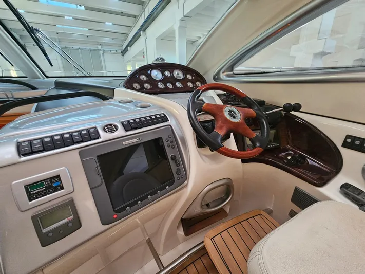 Bruno Dessi Yacht Photos Pics 2006 Cranchi Mediterranee 50 HT yacht cockpit with steering wheel and control panel.