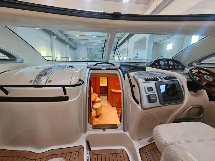 Bruno Dessi Yacht Photos Pics Interior view of 2006 Cranchi Mediterranee 50 HT yacht, featuring sleek design and modern controls.