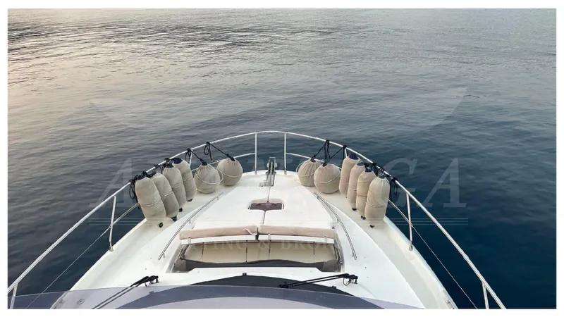  Yacht Photos Pics Bow view of 2012 Prestige 500 yacht on calm water.