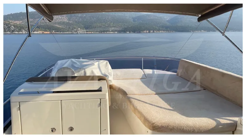  Yacht Photos Pics Flybridge view of 2012 Prestige 500 yacht with scenic ocean backdrop.