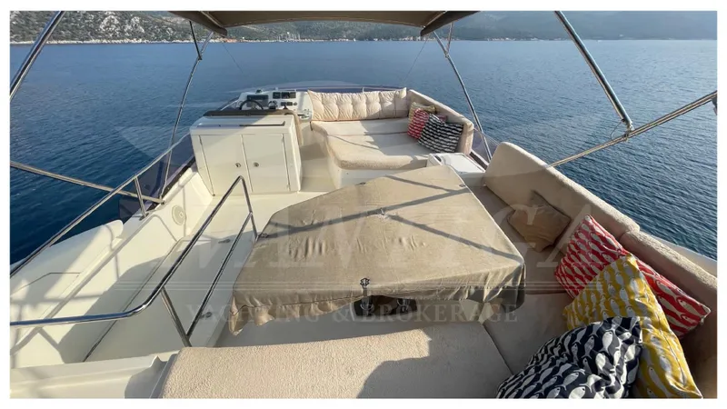  Yacht Photos Pics Luxurious 2012 Prestige 500 yacht deck with seating, cushions, and ocean view.