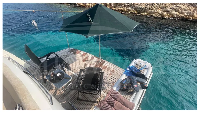  Yacht Photos Pics Prestige 500 yacht deck with umbrella, chairs, and clear blue water, 2012 model.