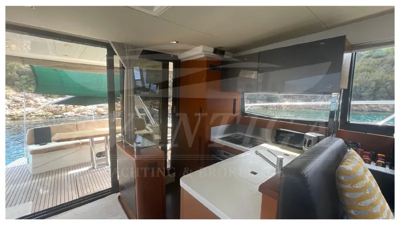  Yacht Photos Pics Interior of 2012 Prestige 500 yacht with modern kitchen and scenic water view.