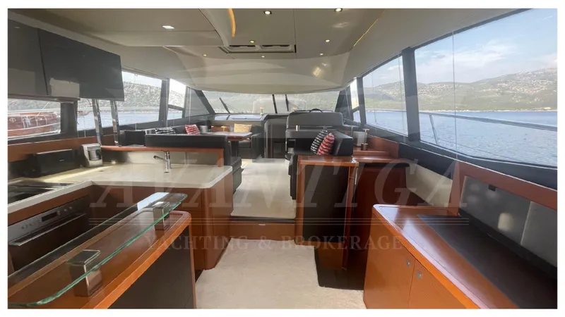  Yacht Photos Pics Luxurious interior of a 2012 Prestige 500 yacht with panoramic windows and modern furnishings.