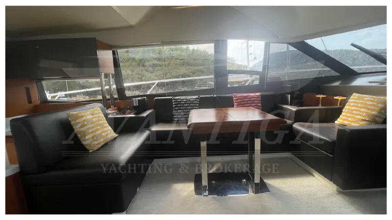  Yacht Photos Pics Luxurious interior of a 2012 Prestige 500 yacht with modern seating and large windows.