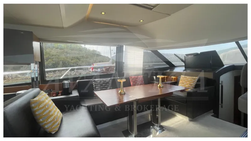  Yacht Photos Pics Luxurious interior of a 2012 Prestige 500 yacht with elegant seating and dining area.