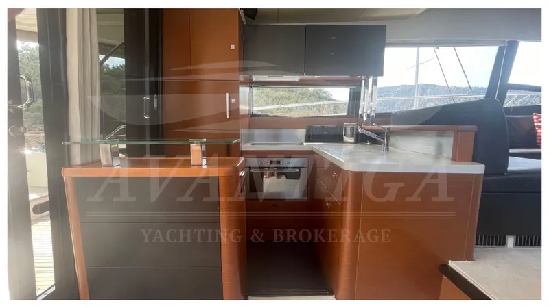  Yacht Photos Pics Interior of 2012 Prestige 500 yacht with modern kitchen and sleek cabinetry.