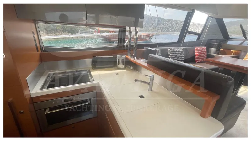  Yacht Photos Pics Modern kitchen interior on a 2012 Prestige 500 yacht with scenic ocean view.