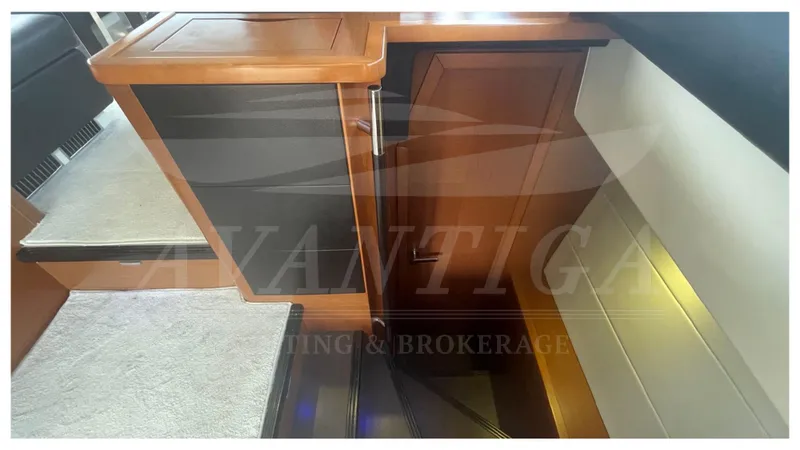  Yacht Photos Pics Interior stairs of a 2012 Prestige 500 yacht with wooden finish.