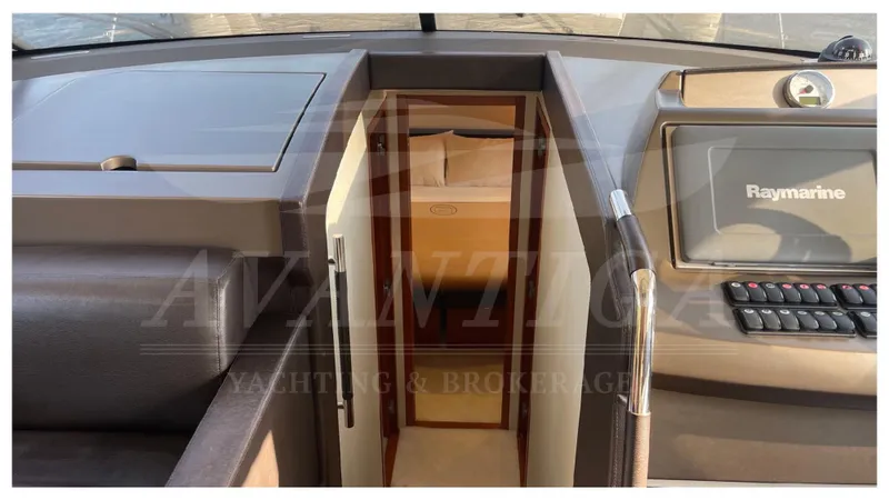  Yacht Photos Pics Interior view of 2012 Prestige 500 yacht cockpit with Raymarine navigation system.