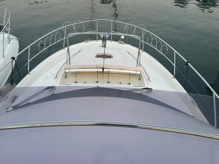  Yacht Photos Pics Front deck of a 2012 Prestige 500 yacht on calm water.