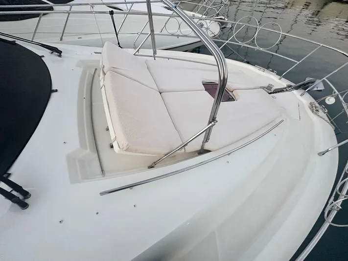  Yacht Photos Pics 2012 Prestige 500 yacht with cushioned sunbathing area on deck.