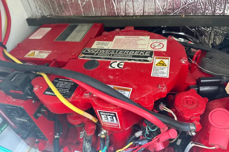  Yacht Photos Pics Red Westerbeke engine in 2021 Jeanneau NC 895 boat, detailed view.