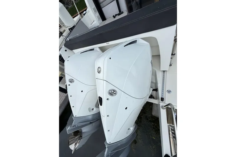  Yacht Photos Pics 2021 Jeanneau NC 895 boat with dual outboard motors, docked.