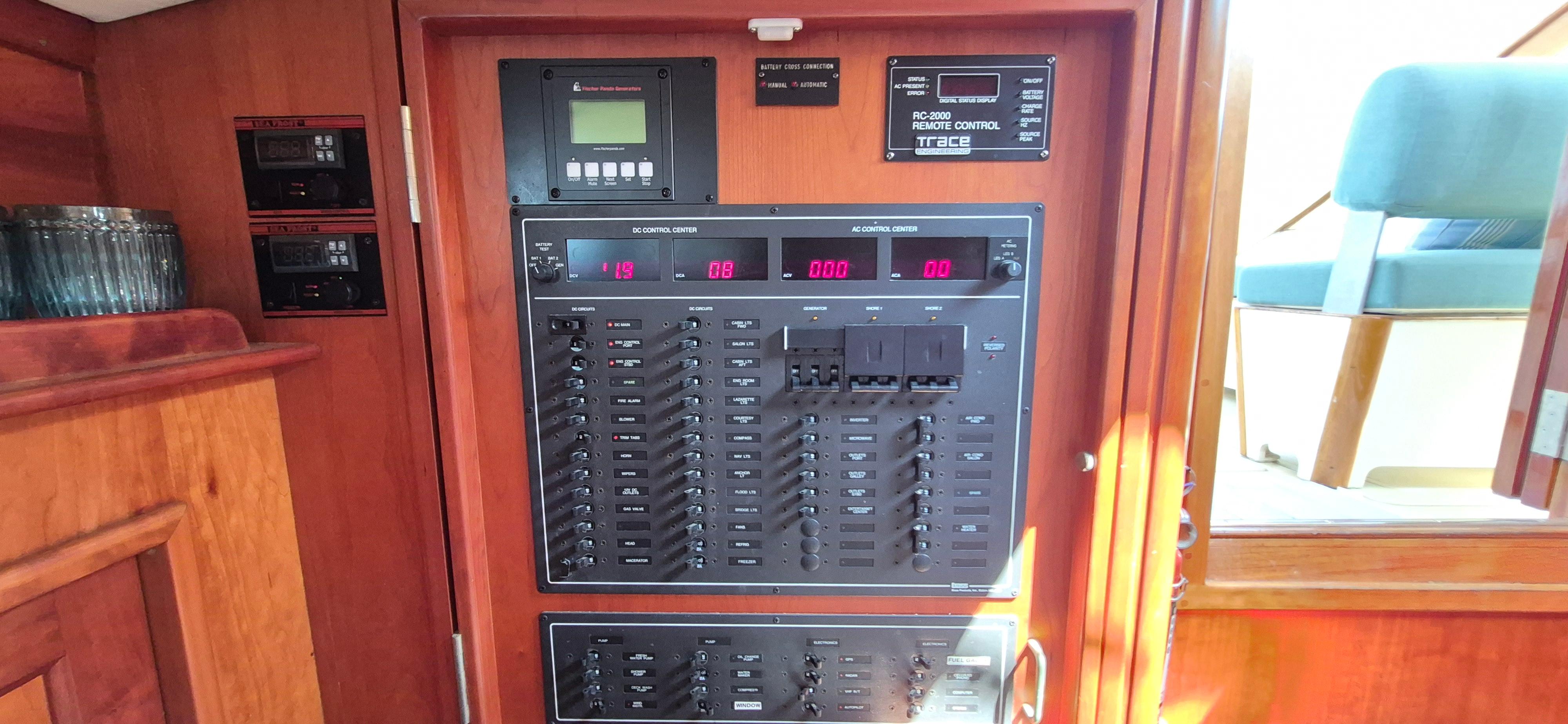 Control panel inside a 1997 Able 44 Downeast Express Cruiser, featuring various switches and displays.