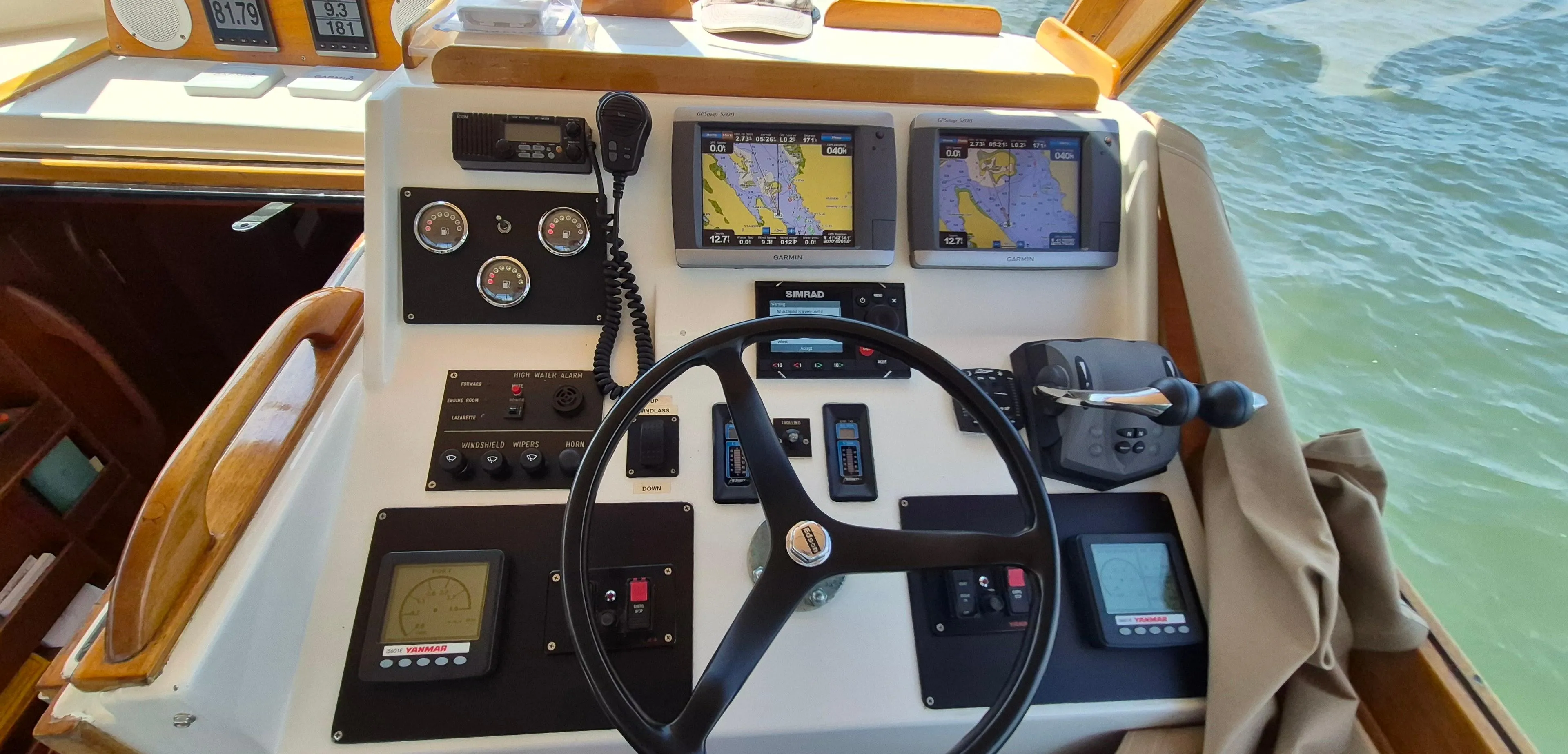 Helm of 1997 Able 44 Downeast Express Cruiser with navigation screens and controls.