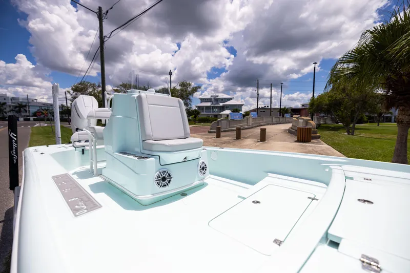  Yacht Photos Pics 2024 Yellowfin 24 CE boat on a sunny day, showcasing sleek design and modern features.