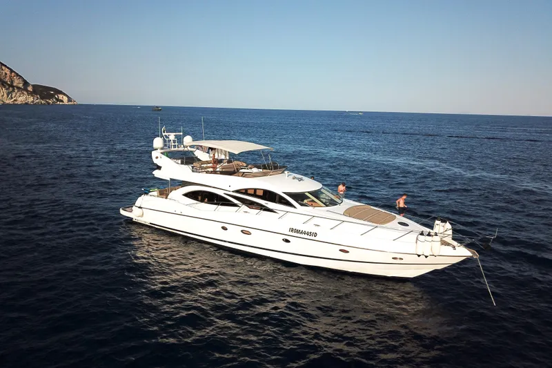  Yacht Photos Pics Luxurious 2003 Sunseeker Manhattan 74 yacht cruising on open sea.