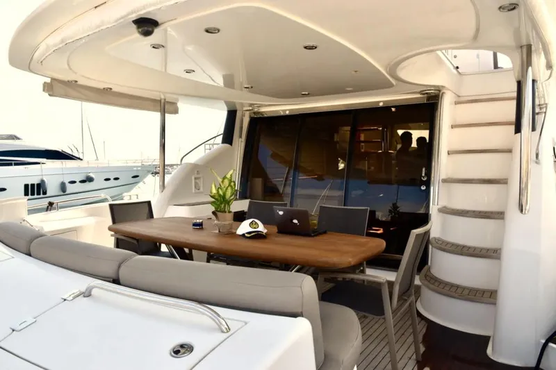  Yacht Photos Pics Luxurious 2003 Sunseeker Manhattan 74 yacht deck with dining area and elegant design.