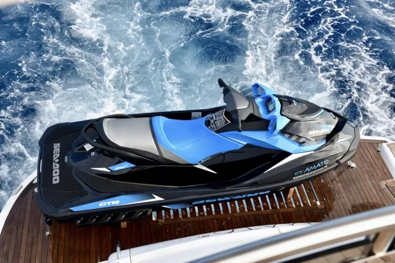  Yacht Photos Pics Blue Sea-Doo jet ski on Sunseeker Manhattan 74 yacht deck, ocean background.