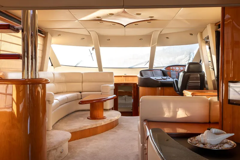  Yacht Photos Pics Luxurious interior of 2003 Sunseeker Manhattan 74 yacht with elegant seating and helm.