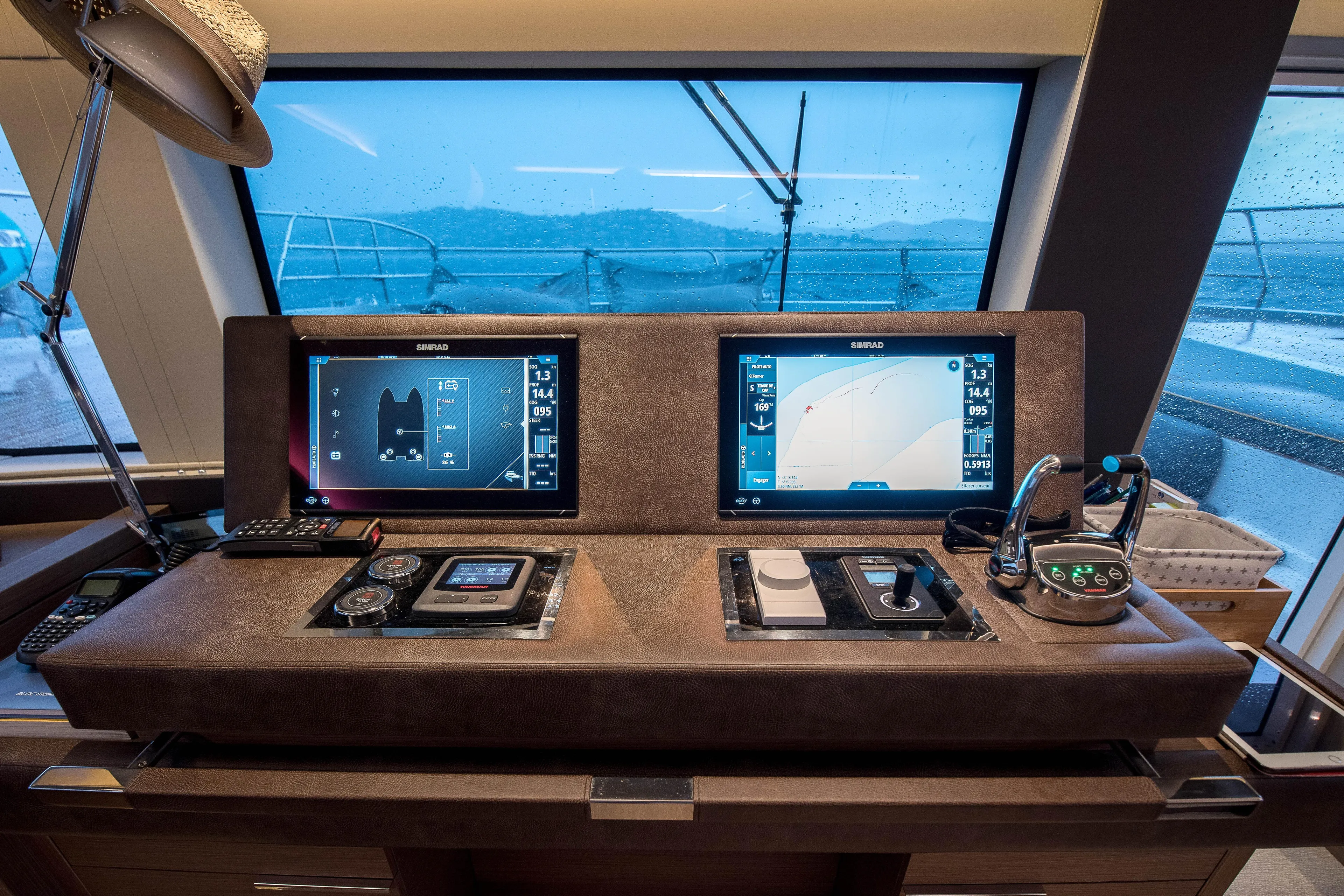 Mahe III Yacht Photos Pics 2023 Lagoon SIXTY 7 yacht cockpit with advanced navigation displays and controls.