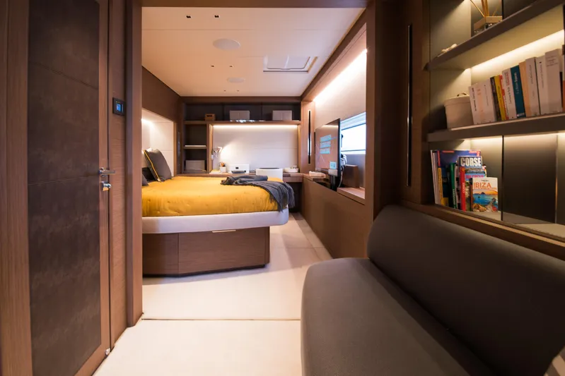 Mahe III Yacht Photos Pics Luxurious interior of 2023 Lagoon SIXTY 7 yacht with modern bedroom and cozy seating area.