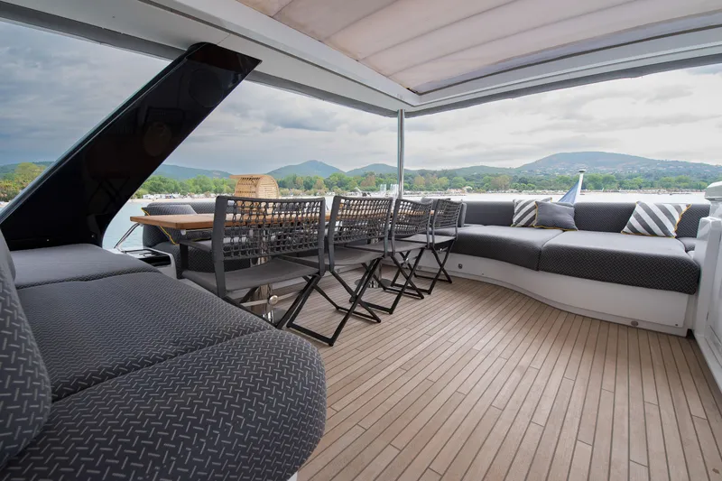 Mahe III Yacht Photos Pics Luxurious 2023 Lagoon SIXTY 7 yacht deck with elegant seating and scenic views.