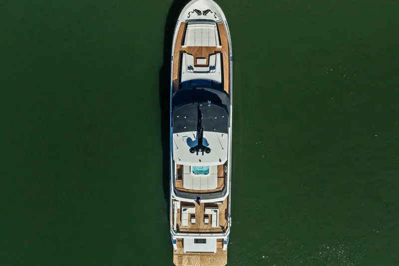 Serenity Now Yacht Photos Pics Aerial view of 2024 Ocean Alexander 35 Revolution yacht on calm water.