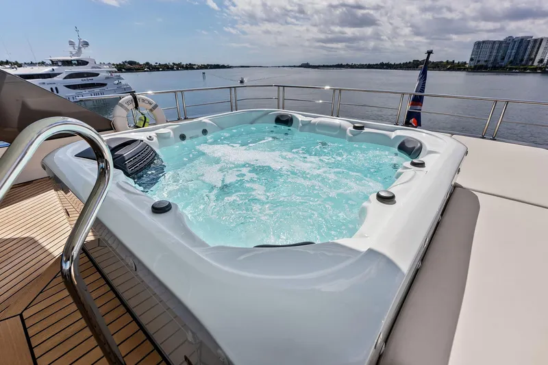 Serenity Now Yacht Photos Pics Luxurious hot tub on 2024 Ocean Alexander 35 Revolution yacht, overlooking serene waters.