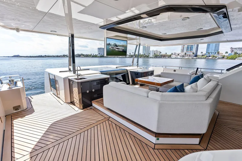 Serenity Now Yacht Photos Pics Luxurious 2024 Ocean Alexander 35 Revolution yacht deck with elegant seating and scenic waterfront view.