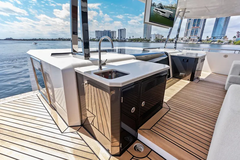 Serenity Now Yacht Photos Pics Luxurious 2024 Ocean Alexander 35 Revolution yacht deck with modern amenities and stunning waterfront view.