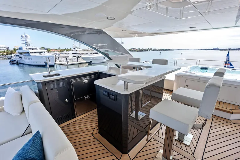 Serenity Now Yacht Photos Pics Luxurious 2024 Ocean Alexander 35 Revolution yacht deck with bar and seating area.