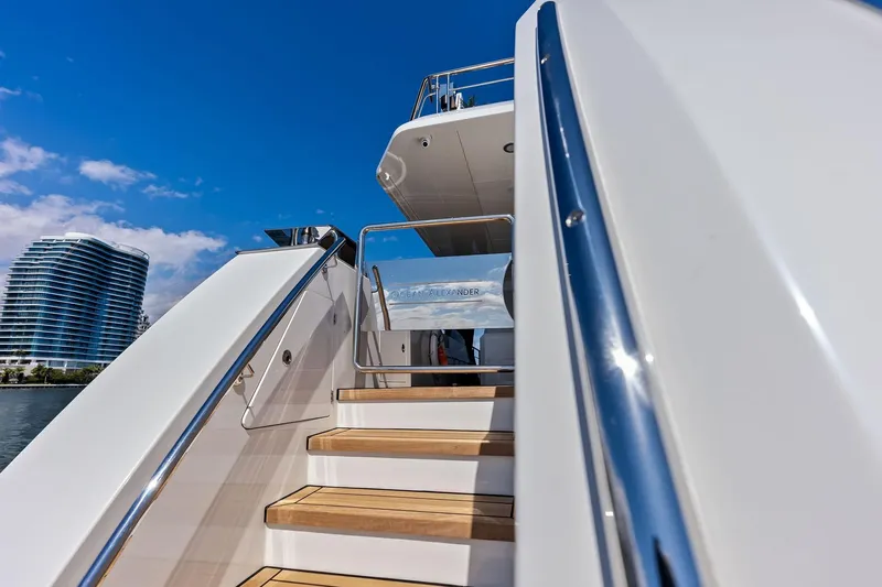 Serenity Now Yacht Photos Pics 2024 Ocean Alexander 35 Revolution yacht stairs with modern architecture in the background.