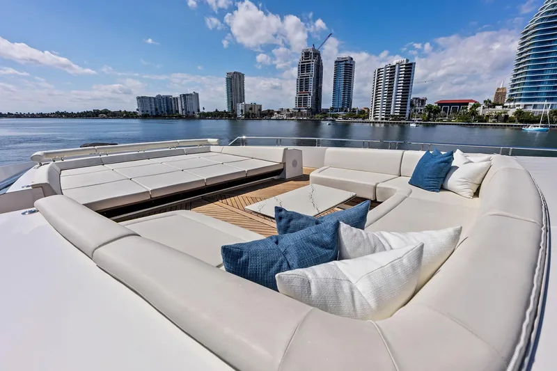 Serenity Now Yacht Photos Pics Luxurious 2024 Ocean Alexander 35 Revolution yacht deck with plush seating and scenic waterfront view.