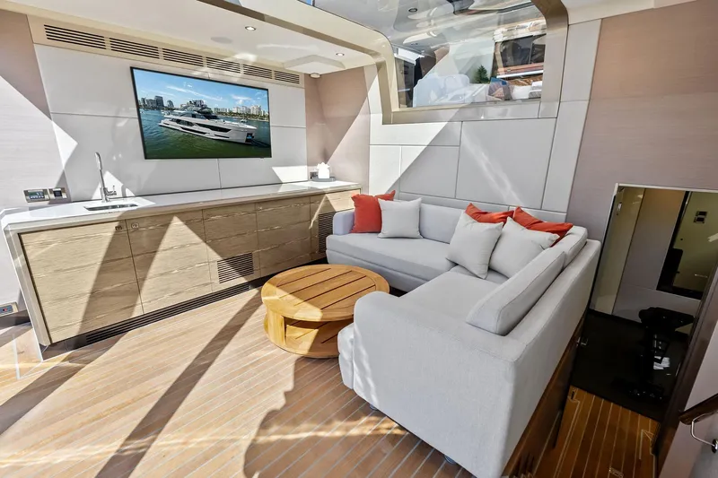 Serenity Now Yacht Photos Pics Luxurious interior of 2024 Ocean Alexander 35 Revolution yacht with modern seating and entertainment area.