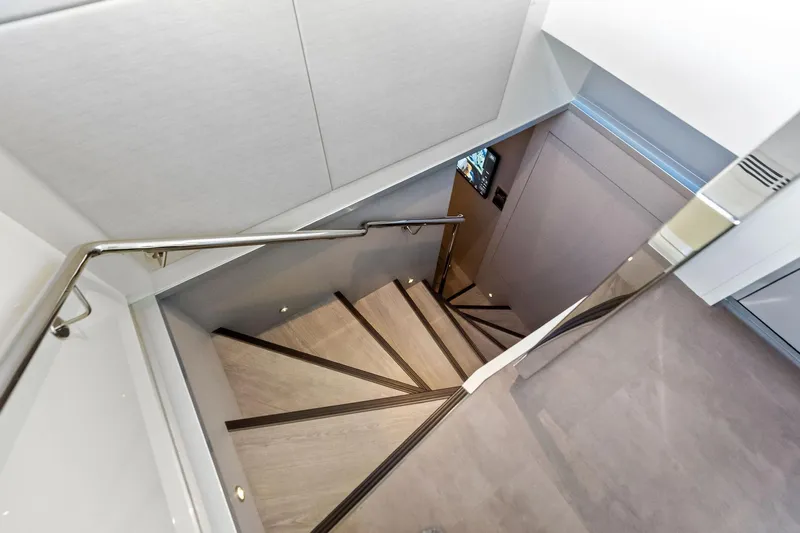 Serenity Now Yacht Photos Pics Staircase inside 2024 Ocean Alexander 35 Revolution yacht, featuring sleek modern design.