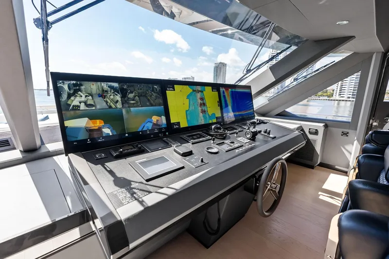 Serenity Now Yacht Photos Pics Modern helm station of 2024 Ocean Alexander 35 Revolution yacht with advanced navigation displays.