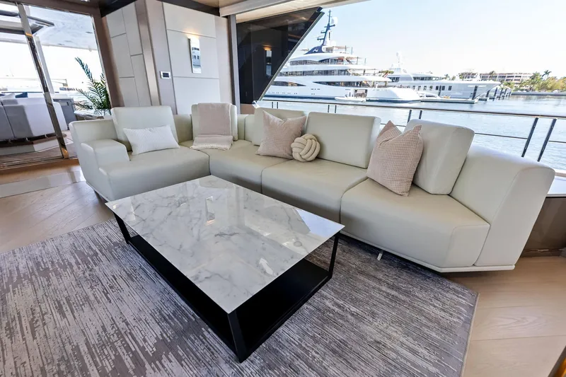 Serenity Now Yacht Photos Pics Luxurious interior of 2024 Ocean Alexander 35 Revolution yacht with elegant seating and marble table.